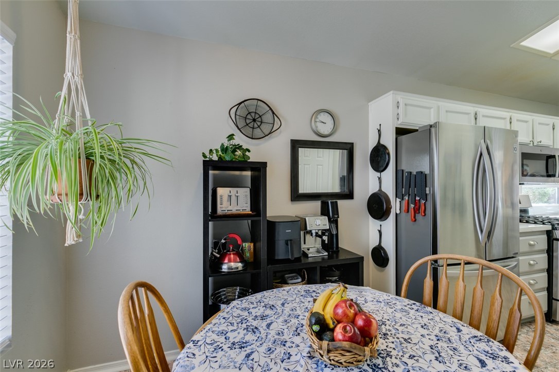 2187 Chapman Ranch Drive Henderson, NV 89012 - Photo 13 of 26 This breakfast nook and dining area offers functional design and modern appliances.