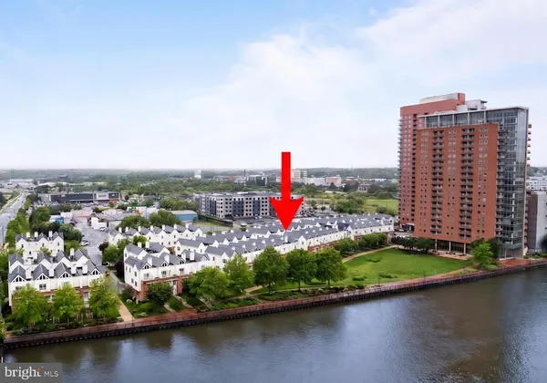 an aerial view of residential building and lake