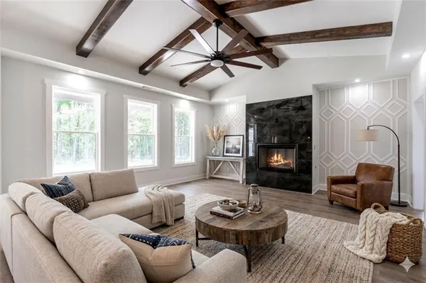 a living room with furniture and a large window