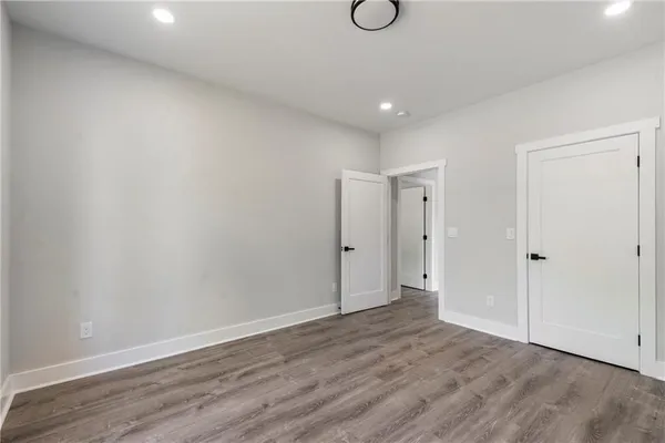 a view of hallway with wooden floor