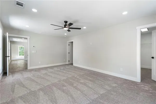 a view of an empty room with a bathroom