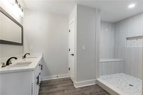 a bathroom with a sink and mirror