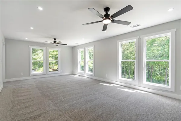 a view of an empty room with a window