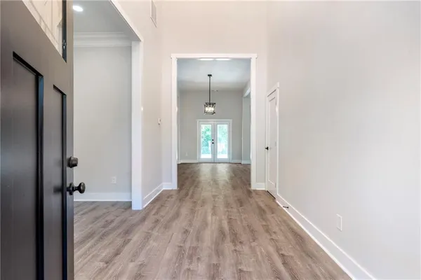 a view of gallery with wooden floor