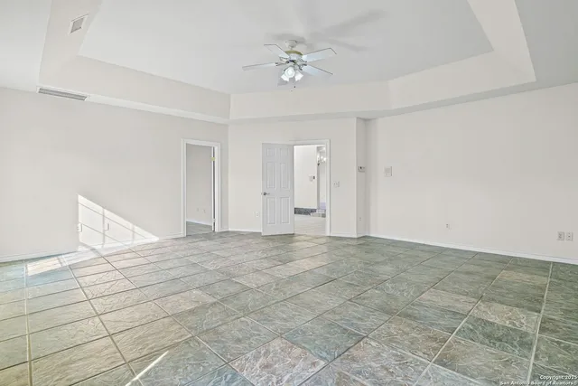 a bathroom with a double vanity sink mirror and bathtub