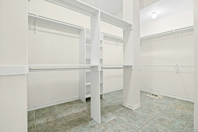 a view of a room with furniture and mirror