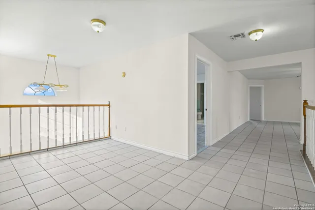 a spacious bathroom with a granite countertop sink a mirror and a shower
