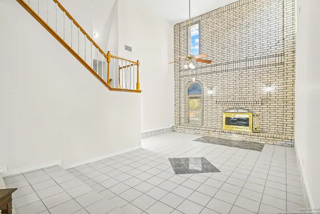 a view of entryway and hall with a dining table