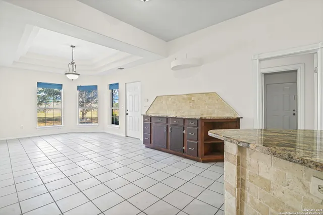 a view of a kitchen with furniture and a chandelier