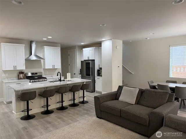 a living room with furniture and a table