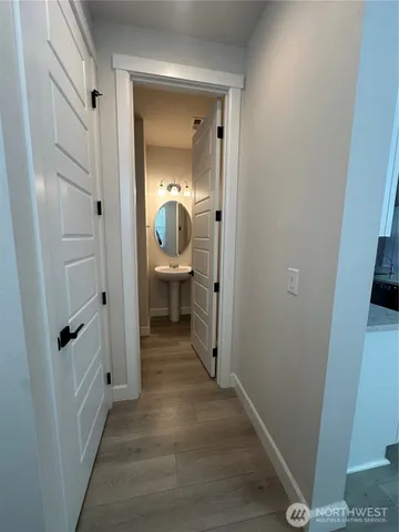 a view of a bathroom from the hallway