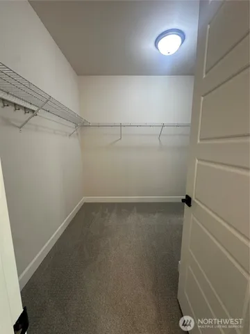 a bathroom with a toilet sink and window