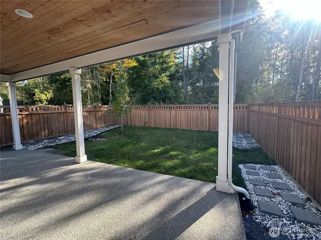 a view of a backyard with green space