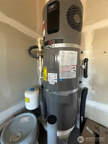 a view of a backyard with wooden fence