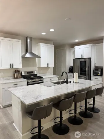 a kitchen with a dining table and chairs