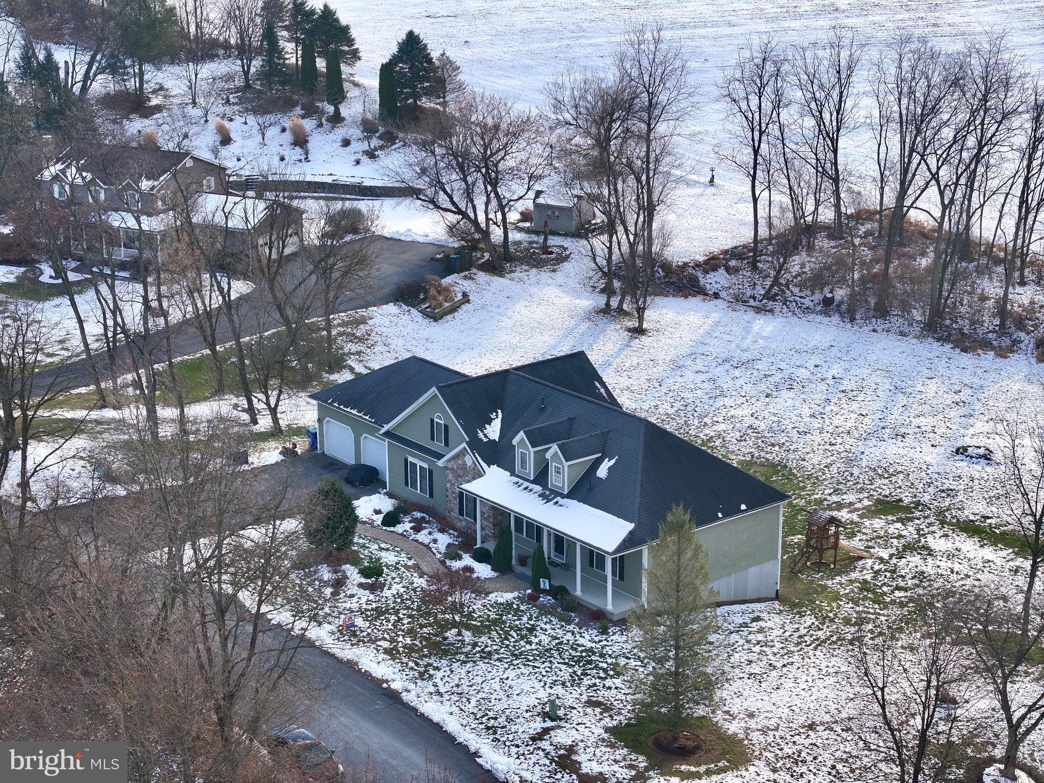 223 Country Road Lewisburg, PA 17837 - Photo 5 of 46 Charming home nestled in a winter landscape.