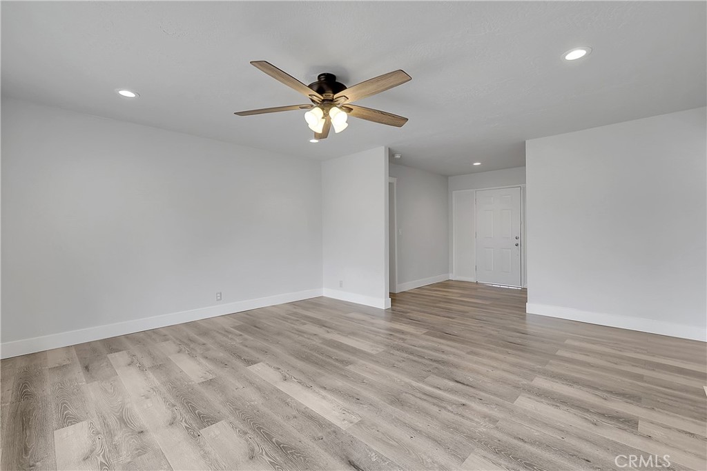 75 Lariat Loop Oroville, CA 95966 - Photo 17 of 47 a view of an empty room with wooden floor and a ceiling fan