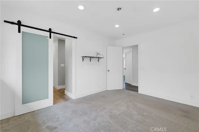 a view of an empty room with a glass door