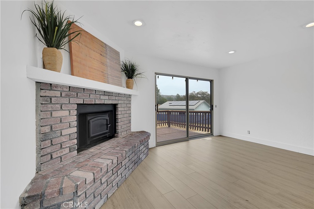 75 Lariat Loop Oroville, CA 95966 - Photo 31 of 47 an empty room with windows and fireplace