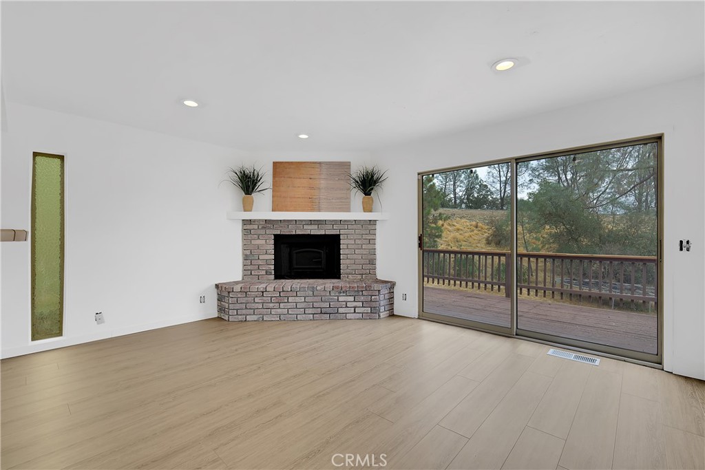 75 Lariat Loop Oroville, CA 95966 - Photo 8 of 47 a view of empty room with floor to ceiling window and fireplace