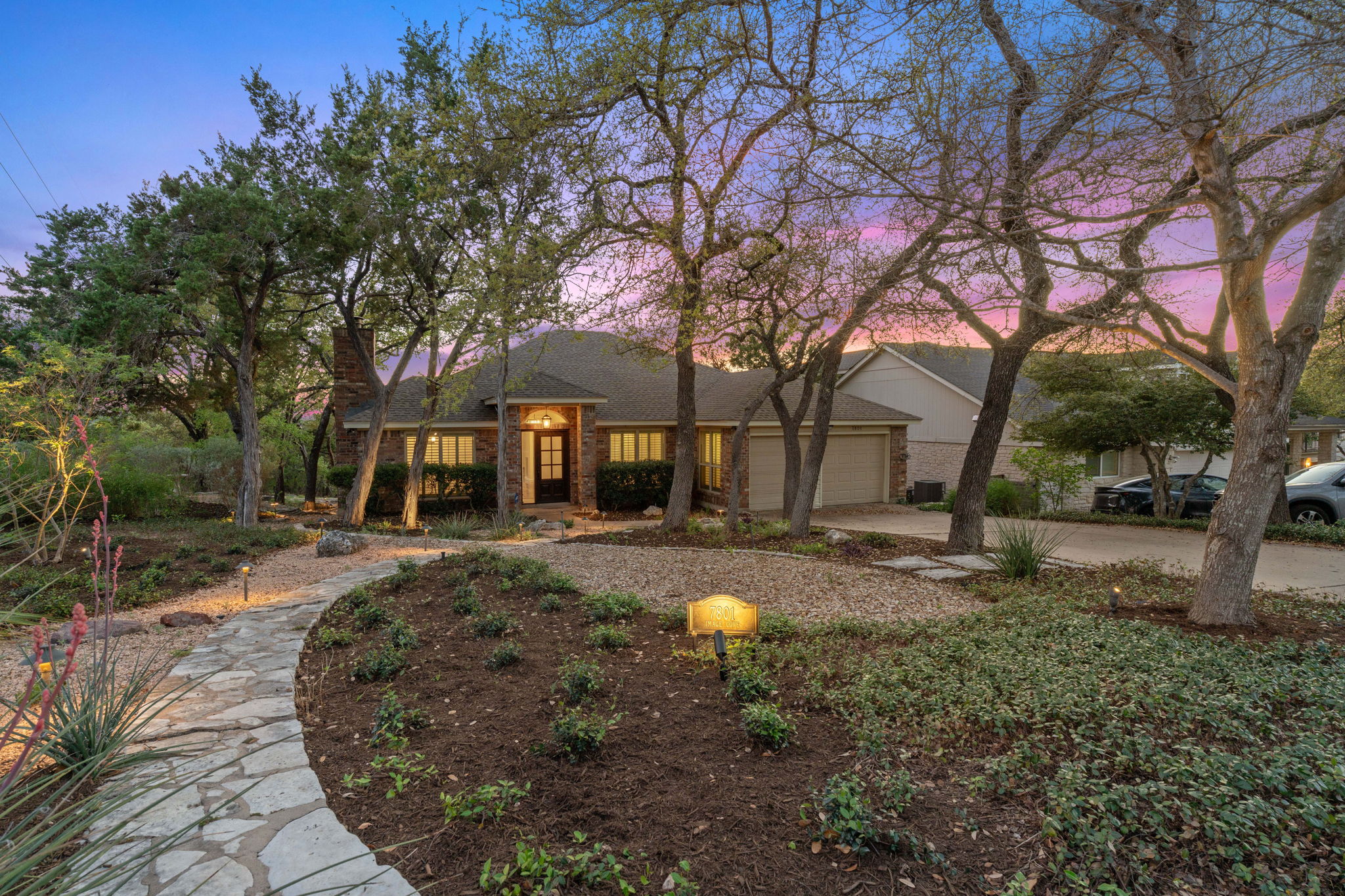 7801 Image Cove Austin, TX 78730 - Photo 1 of 26 a front view of a house with yard tree and outdoor seating