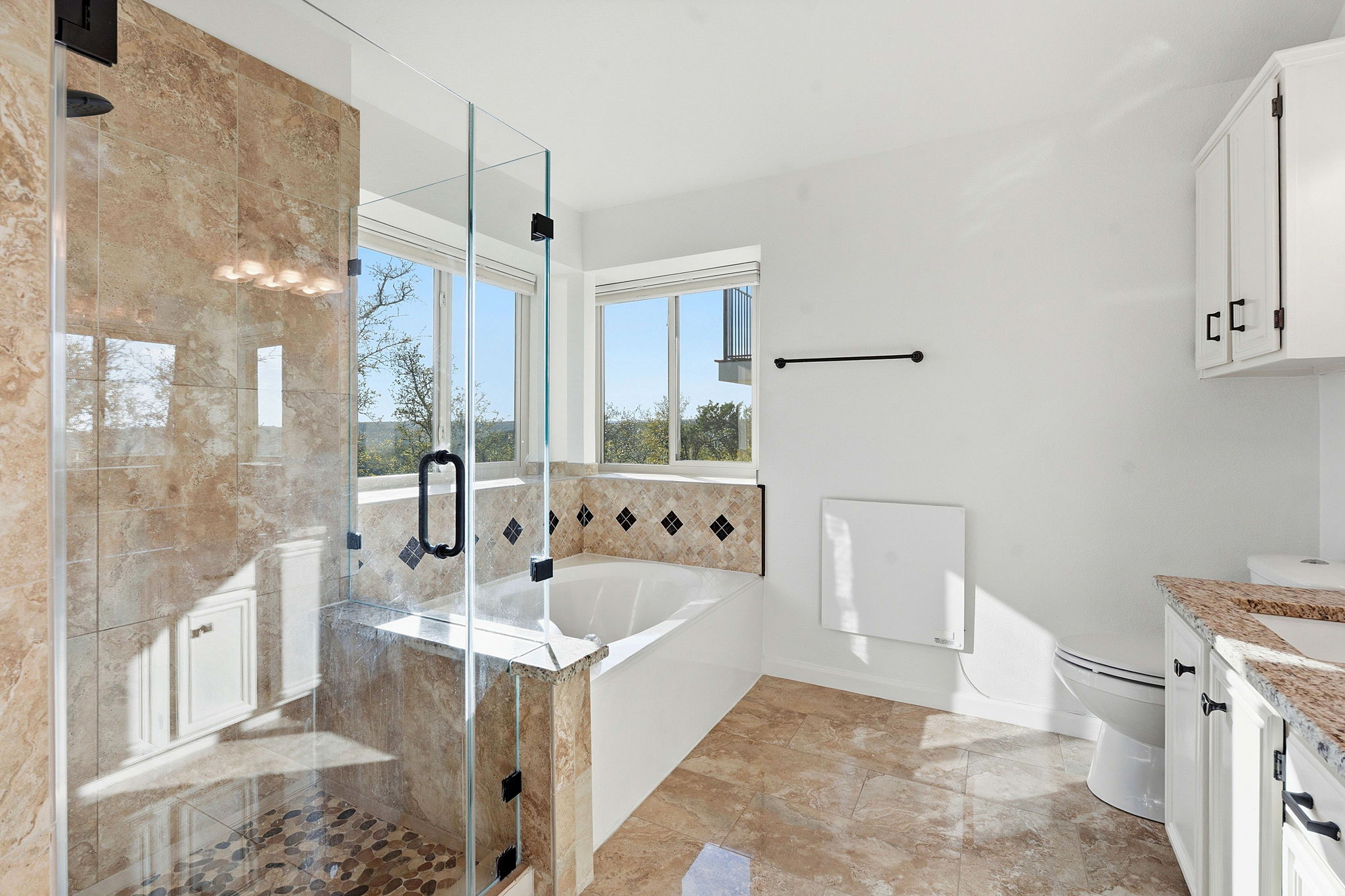 7801 Image Cove Austin, TX 78730 - Photo 13 of 26 a bathroom with a bathtub sink and mirror