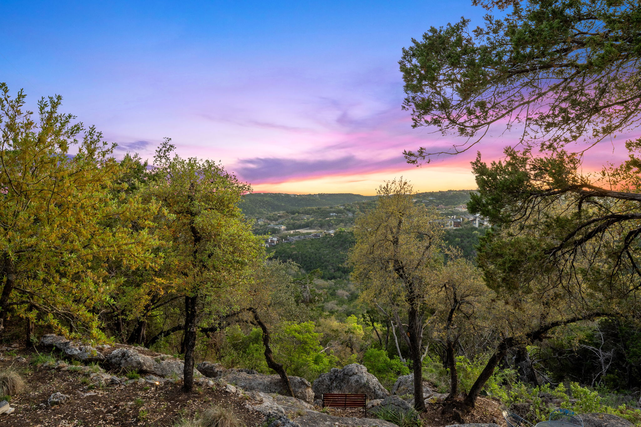 7801 Image Cove Austin, TX 78730 - Photo 23 of 26 a view of a city with lush green forest