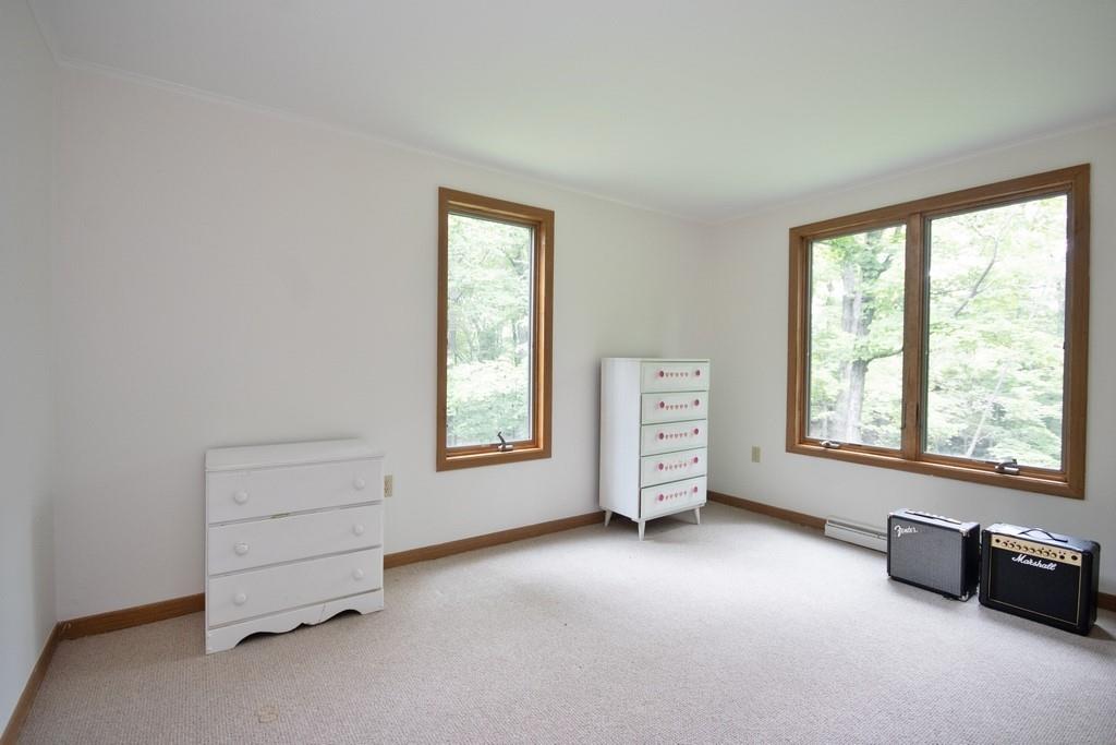 107 Lane Gate Road Cold Spring, NY 10516 - Photo 17 of 45 an empty room with windows and closet