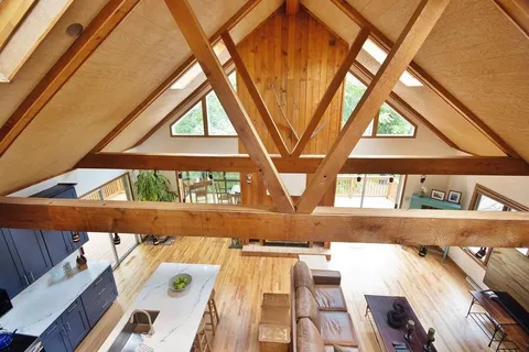 a view of a living room area with furniture and a window