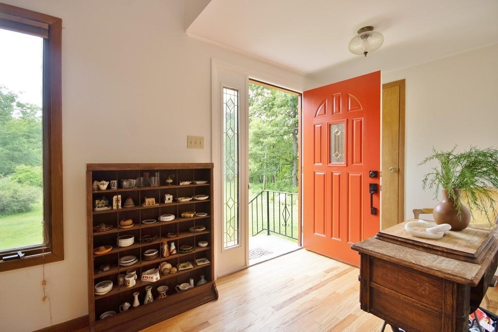107 Lane Gate Road Cold Spring, NY 10516 - Photo 6 of 45 a living room with furniture and a floor to ceiling window