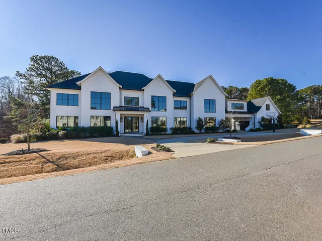 a view of multiple houses with a street