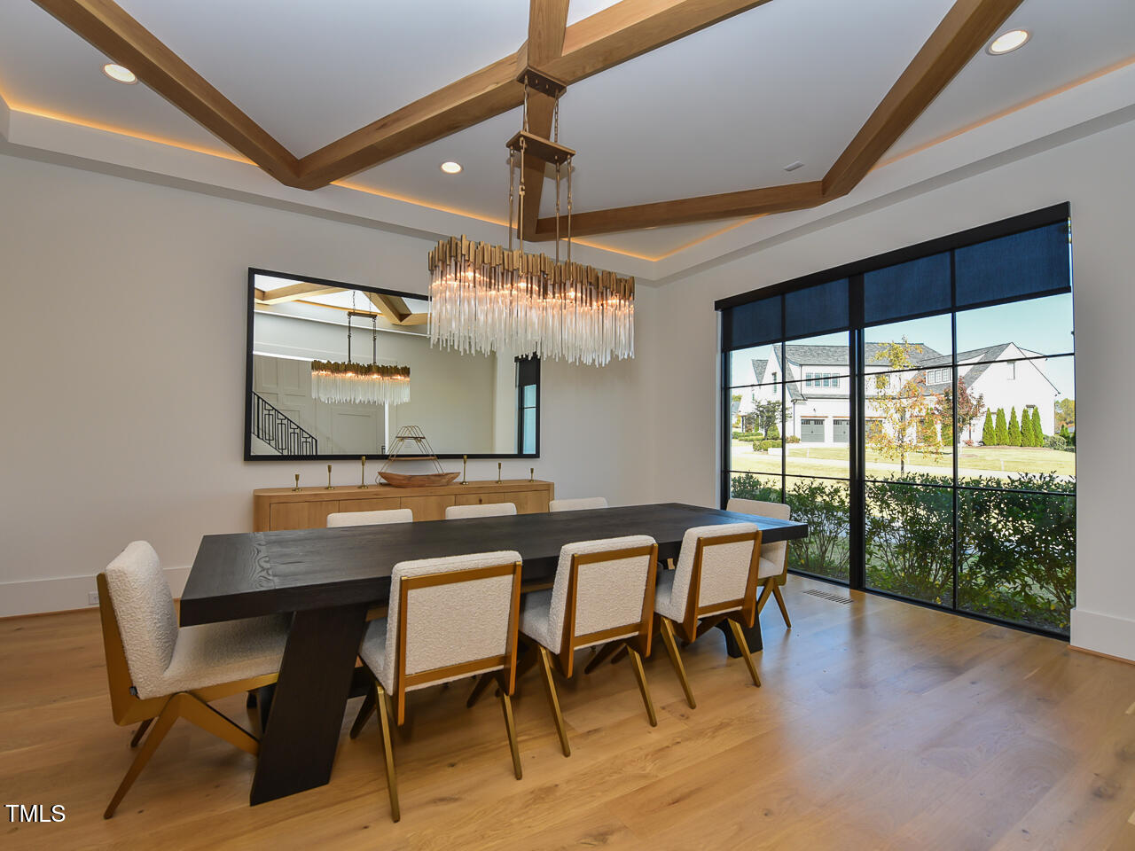 1425 Sky Vista Way Raleigh, NC 27613 - Photo 18 of 67 a dining room with furniture a chandelier and wooden floor