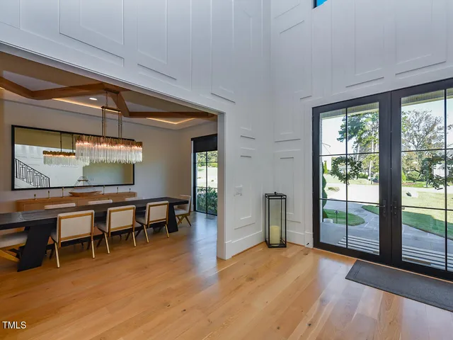 a view of an empty room with glass door