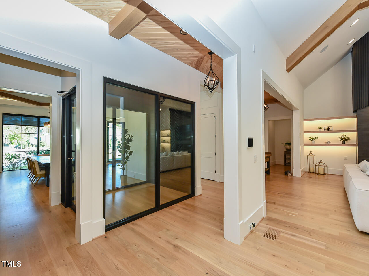 1425 Sky Vista Way Raleigh, NC 27613 - Photo 21 of 67 a view of a hallway view with wooden floor and living room