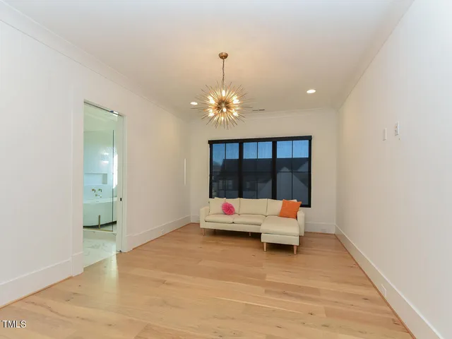 a view of a yard with wooden fence