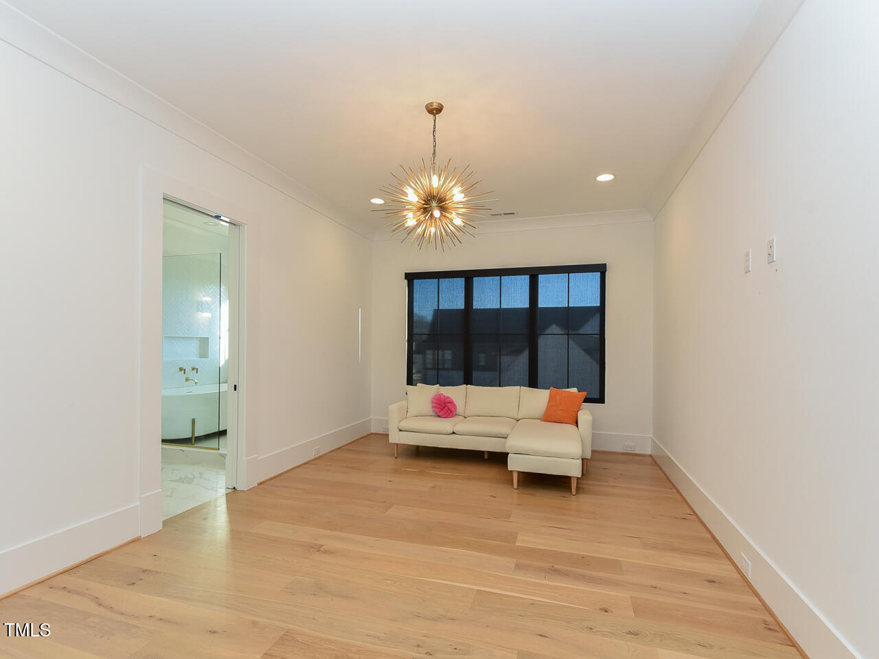 1425 Sky Vista Way Raleigh, NC 27613 - Photo 48 of 67 a living room with furniture and a chandelier