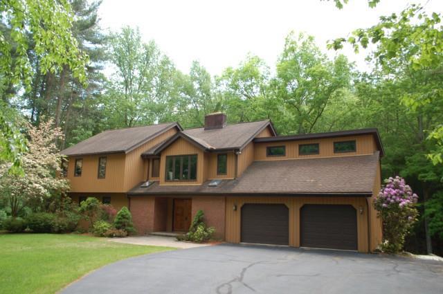 10 Deerfield Road Brookfield, CT 06804 - Photo 1 of 1 a front view of a house with a garden