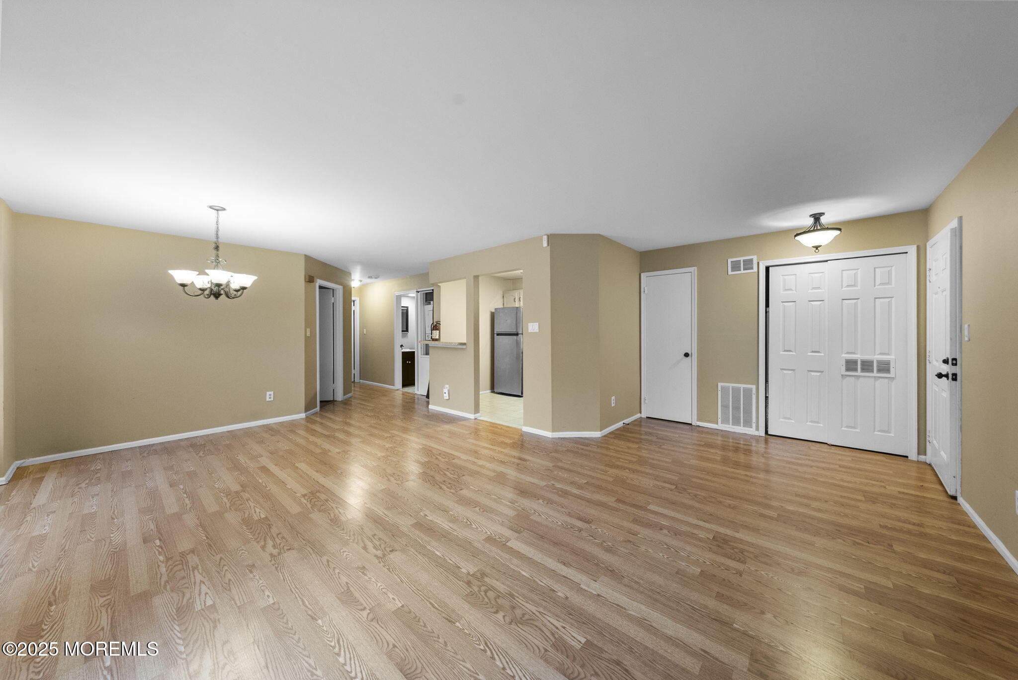 353 Sequoia Court Howell, NJ 07731 - Photo 11 of 27 a view of empty room with wooden floor