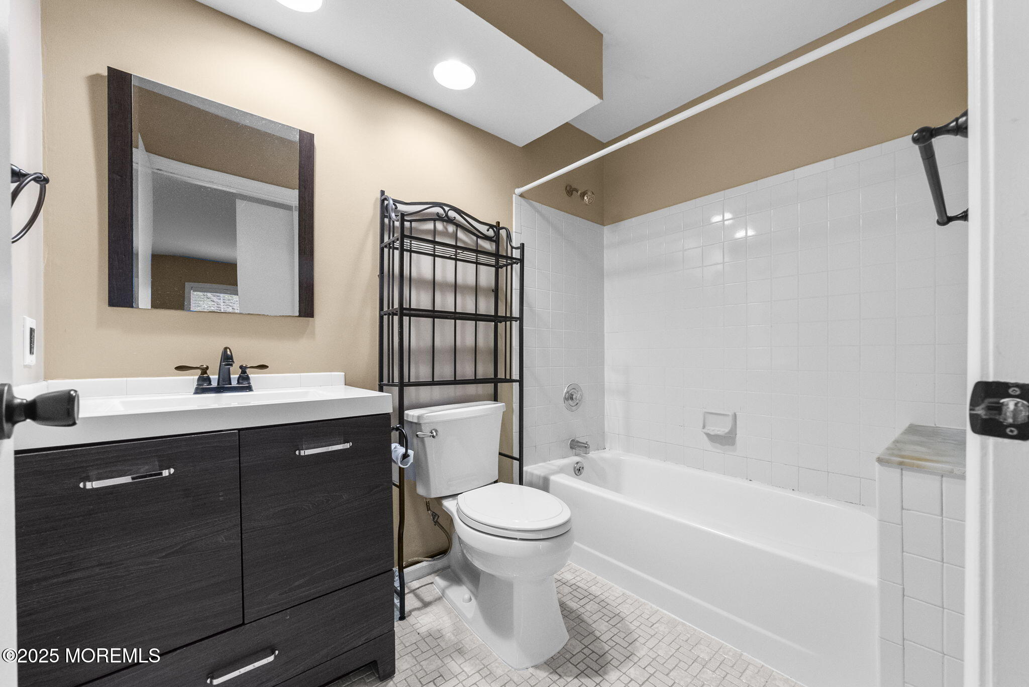 353 Sequoia Court Howell, NJ 07731 - Photo 14 of 27 a bathroom with a toilet sink and mirror