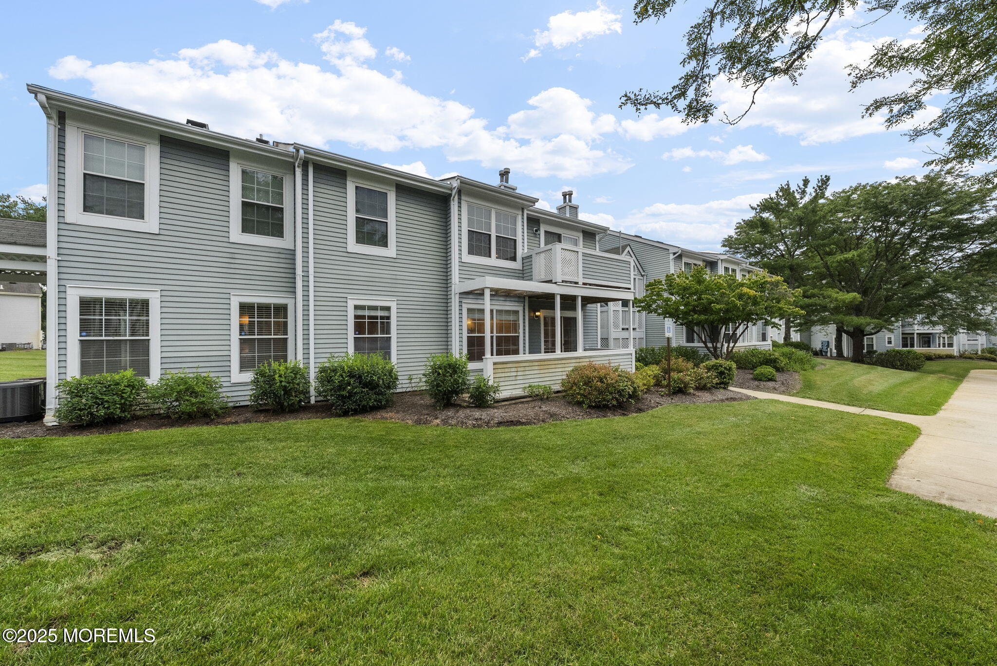 353 Sequoia Court Howell, NJ 07731 - Photo 2 of 27 a front view of a house with garden