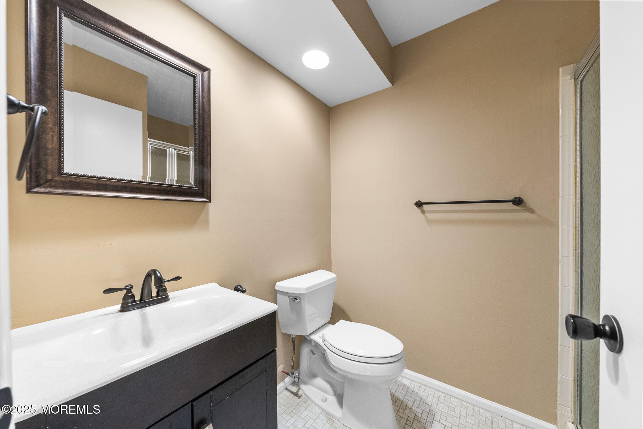 353 Sequoia Court Howell, NJ 07731 - Photo 21 of 27 a white toilet sitting next to a bathroom sink