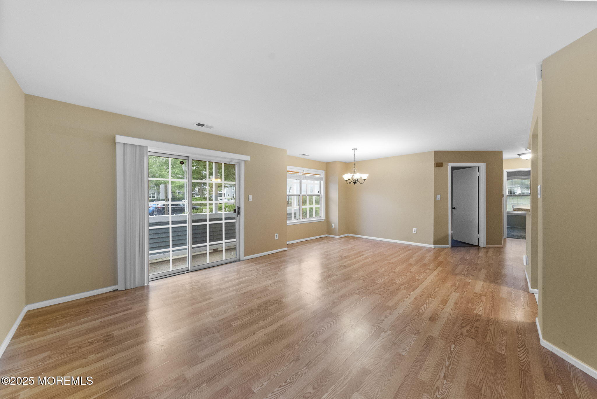 353 Sequoia Court Howell, NJ 07731 - Photo 7 of 27 a view of empty room with wooden floor and fan