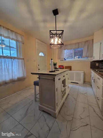 a kitchen with stainless steel appliances granite countertop a sink and cabinets