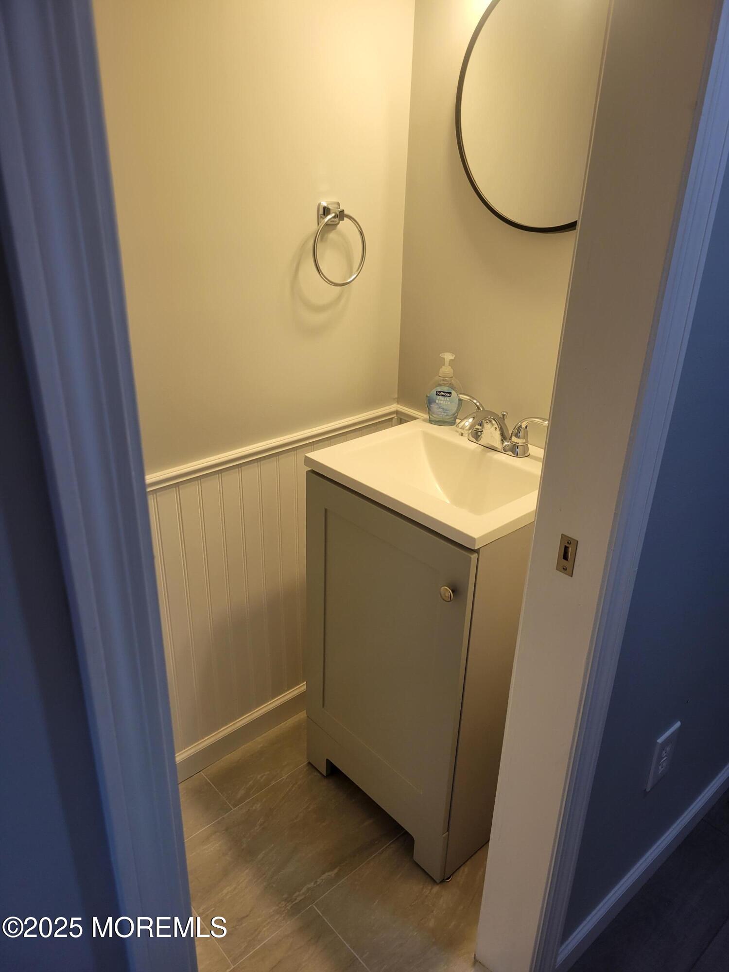 20 Judith Way Jackson, NJ 08527 - Photo 14 of 22 a bathroom with a sink and mirror