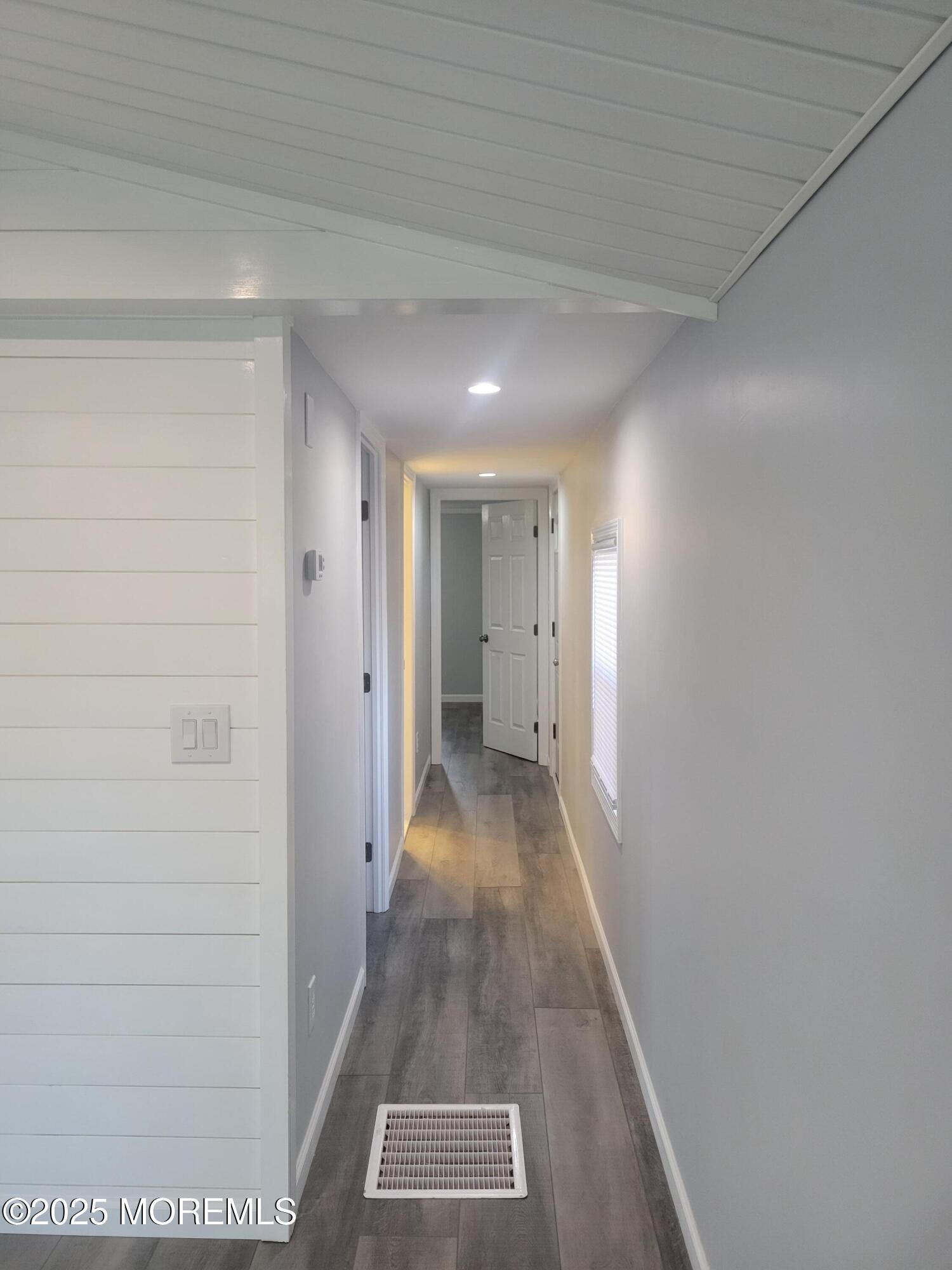 20 Judith Way Jackson, NJ 08527 - Photo 9 of 22 a view of a hallway with wooden floor