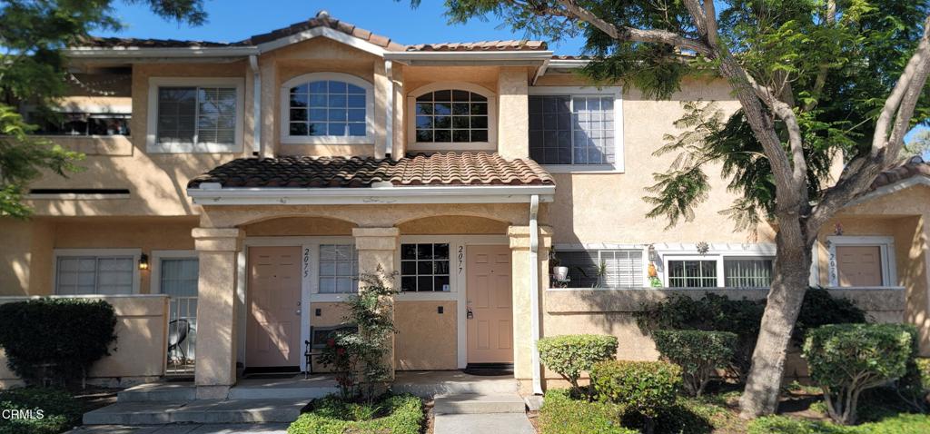 2077 Blackberry Circle Oxnard, CA 93036 - Photo 4 of 20 a front view of a house with garden