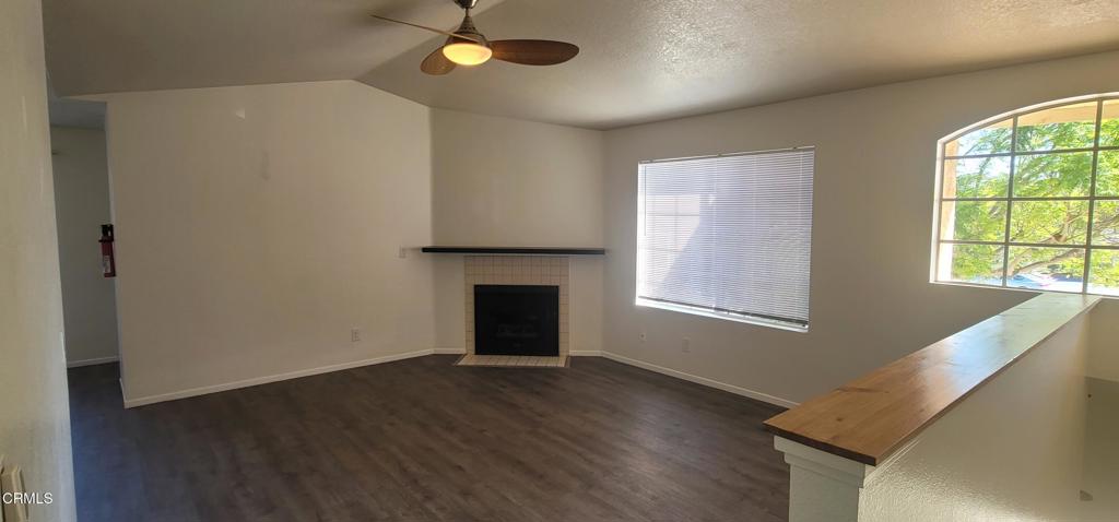 2077 Blackberry Circle Oxnard, CA 93036 - Photo 10 of 20 a view of an empty room with wooden floor and a window