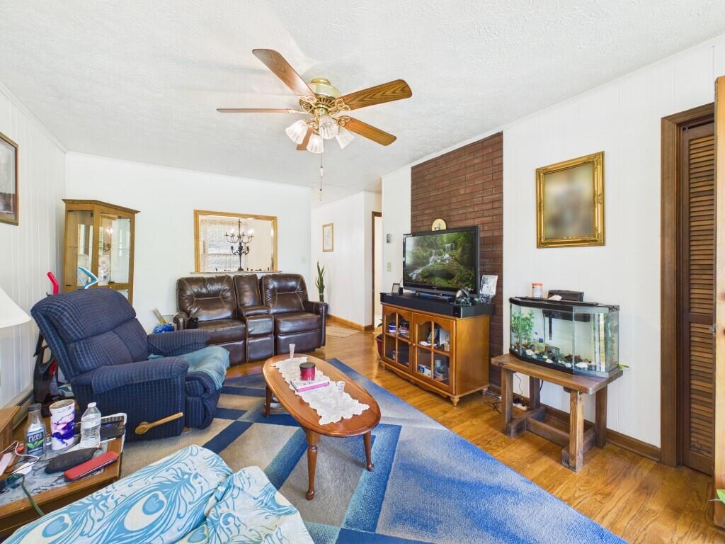 404 Baker Island Road Max Meadows, VA 24360 - Photo 22 of 66 a living room with furniture and wooden floor