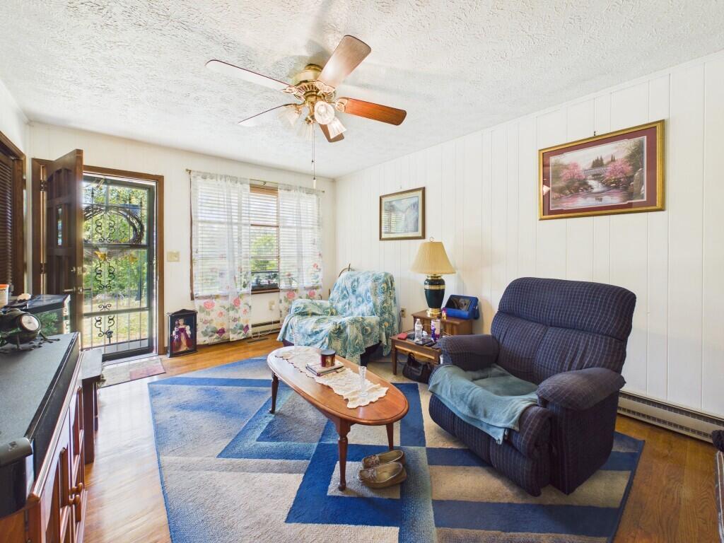 404 Baker Island Road Max Meadows, VA 24360 - Photo 23 of 66 a living room with furniture a large window and a table