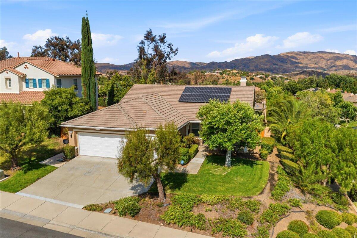 23732 Bella Vista Road Corona, CA 92883 - Photo 40 of 49 a view of a house with a yard and a pool